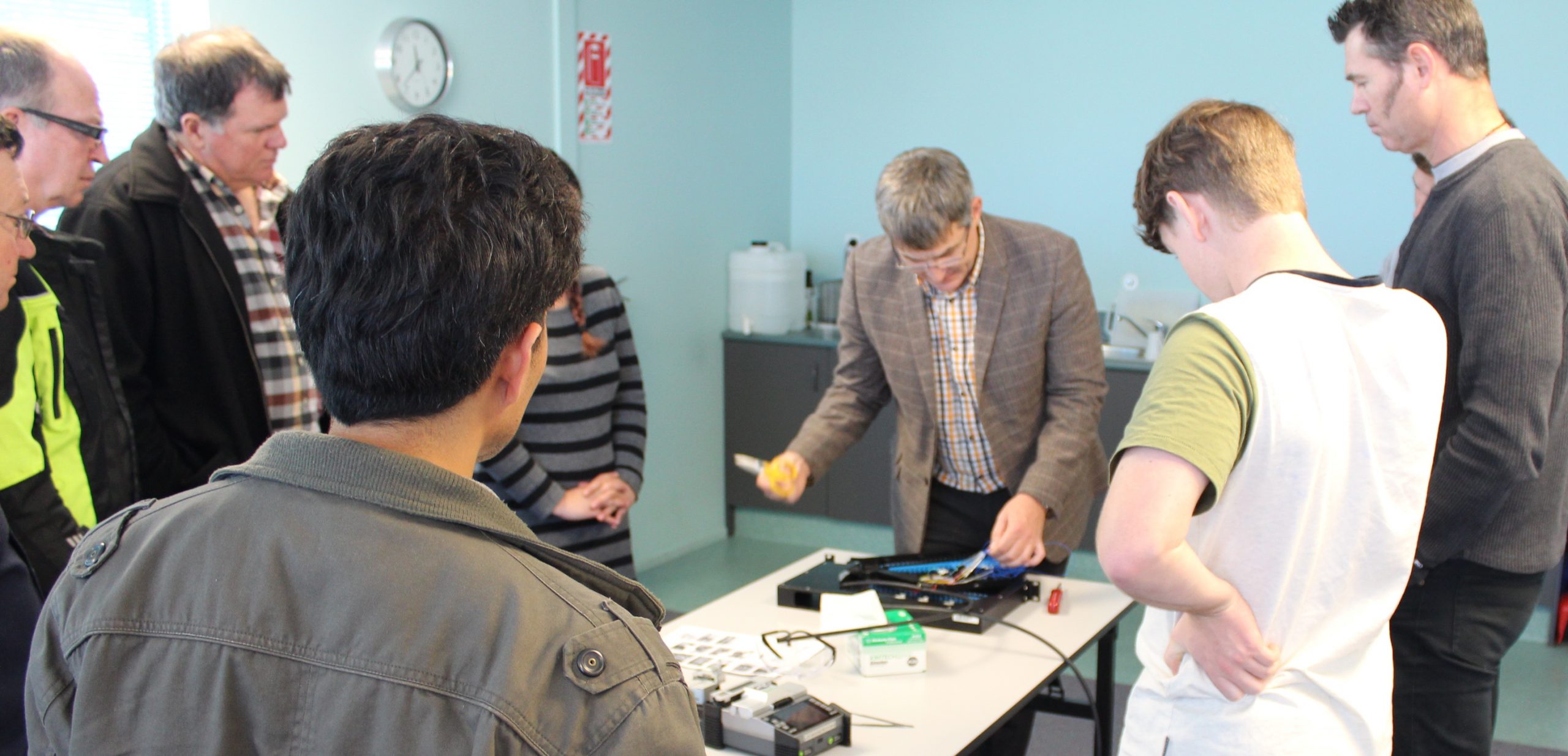 Andy Edwards trains fiber optic students how to splice fiber during a test equipment training
